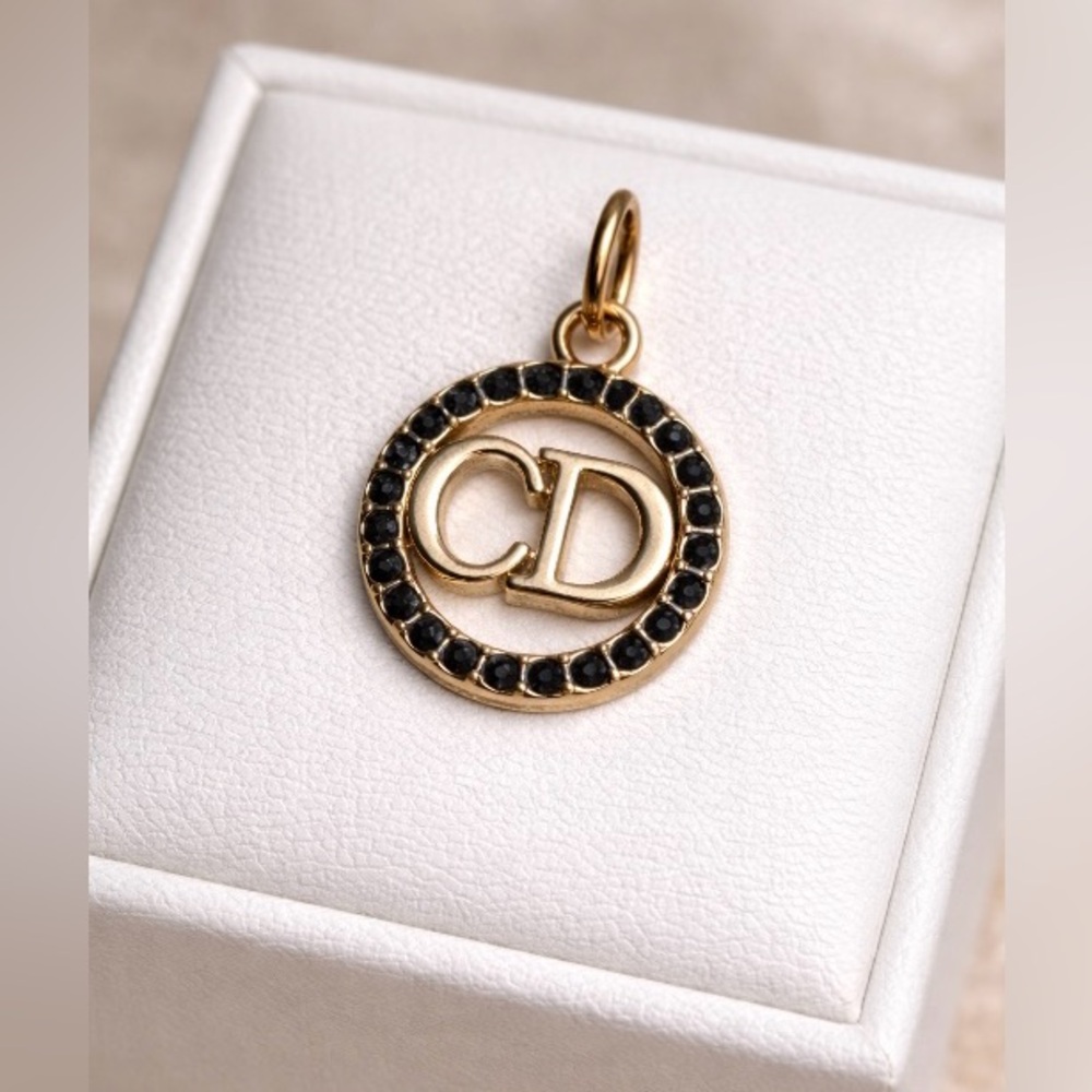 Luxury stamped Christian Dior  Gold and Black Pendant/ charm